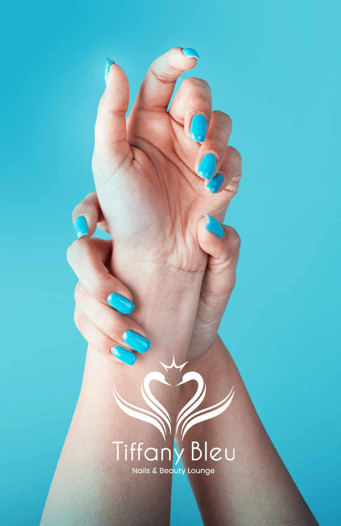 Tiffany Bleu manicure with bright teal polish on a blue background